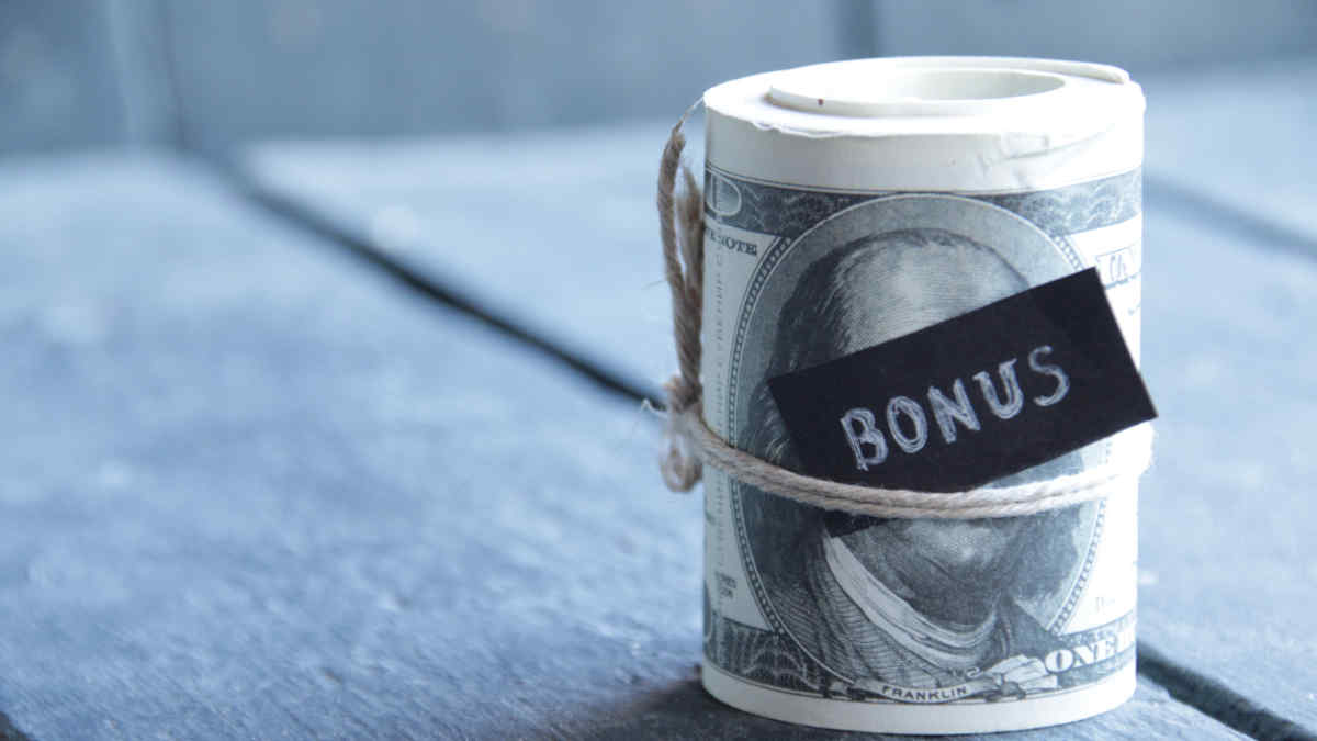 What is the difference between a discretionary and a nondiscretionary bonus?